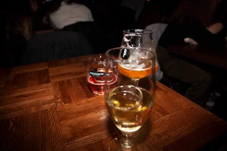 Three different alcoholic drinks on the table of a bar