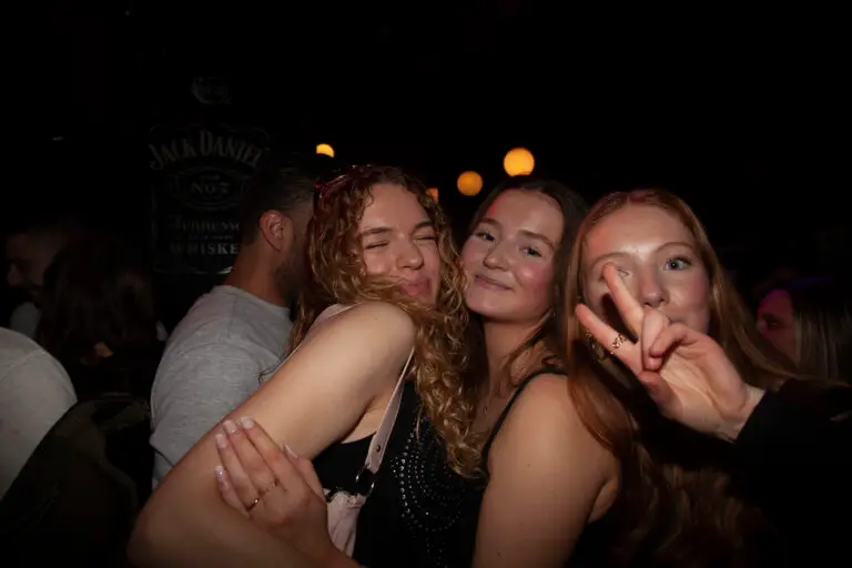 Three girlfriends posing for the camera