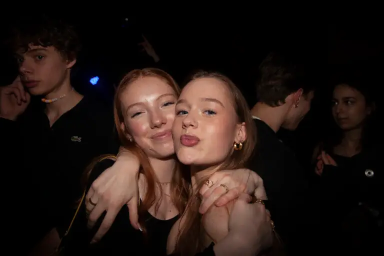 Two redhead girlfriends posing cheek to cheek for the camera